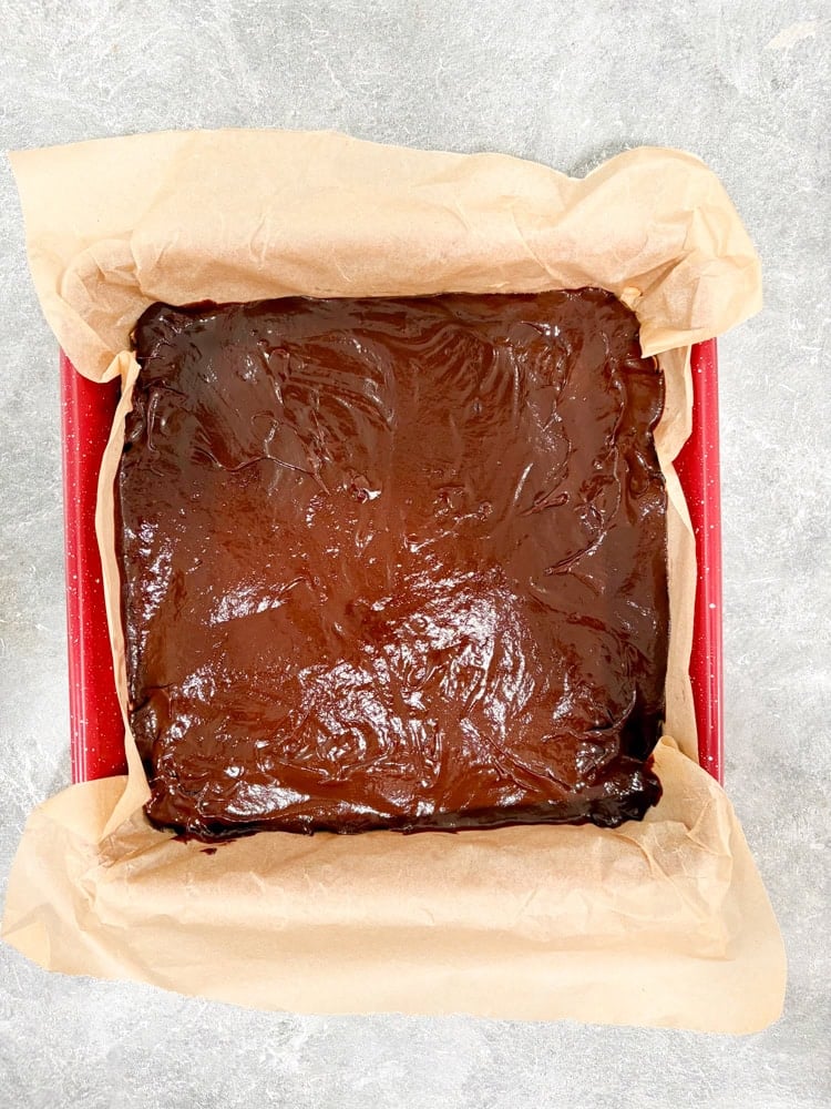 Pour the ganache over the chilled caramel layer.