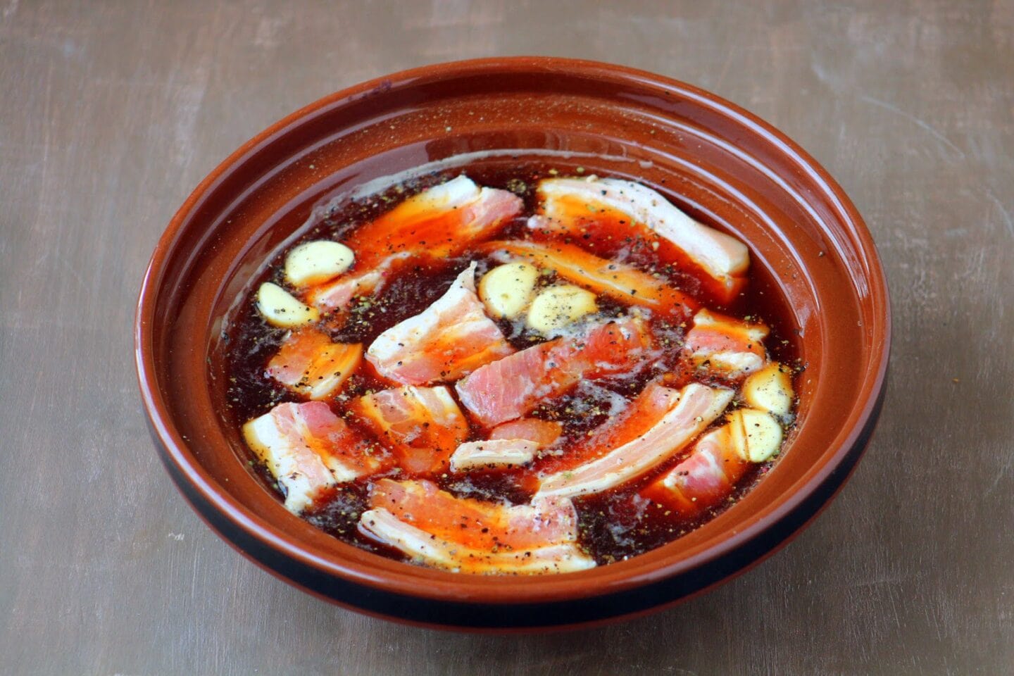 Mix together all the marinade ingredients in a large glass bowl or dish. Place the pork pieces in the bowl and marinate for at least 4 hours but preferably overnight for more flavor absorption.