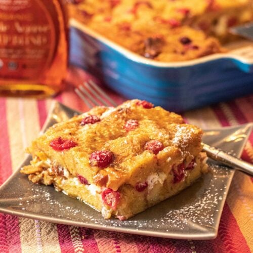 Make-ahead Cranberry Eggnog French Toast Casserole for the holidays! Sweet eggnog, tart cranberries, and crunchy pecans create the perfect Christmas, Thanksgiving, or New Year breakfast or brunch!