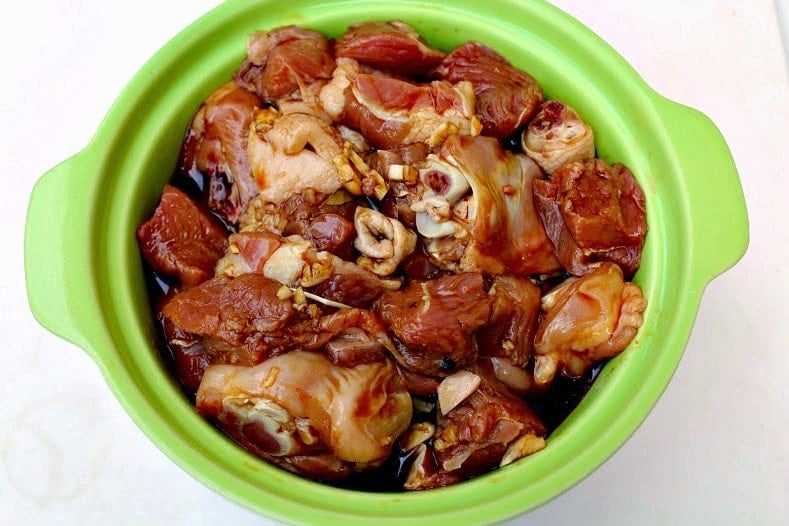 Prepare the marinade. Place the chicken and pork pieces in a non-reactive bowl. Pour the marinade and ensure all the pieces are evenly coated.