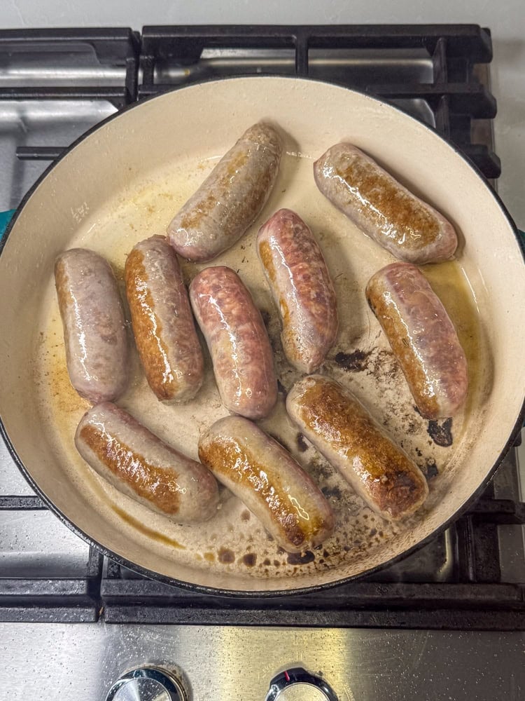 Sausages in pan.