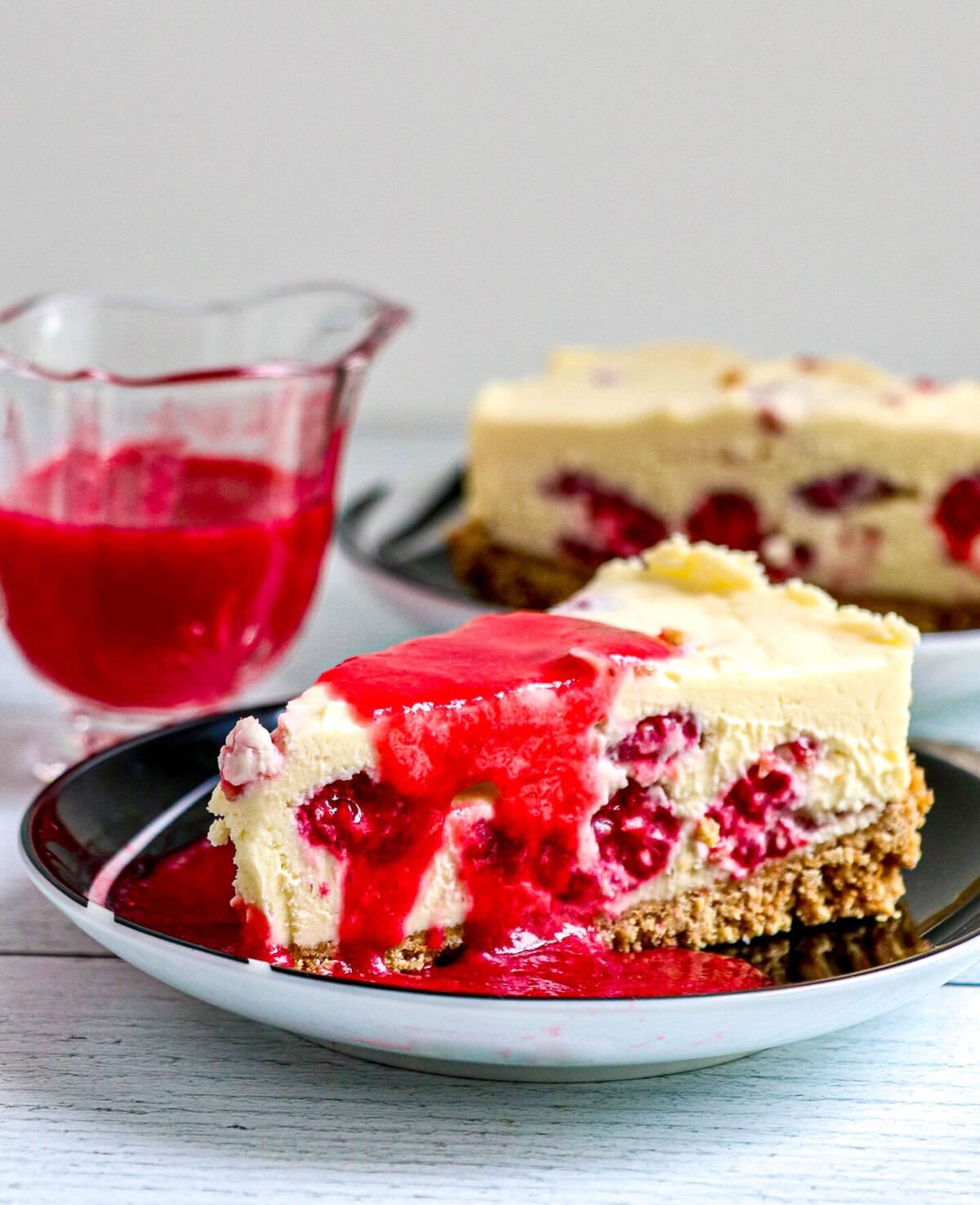 Raspberry Sauce over cheesecake.