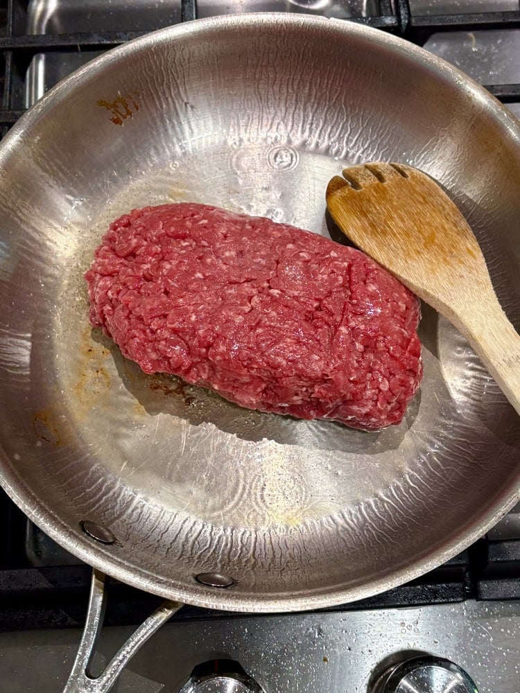 Browning the ground beef.