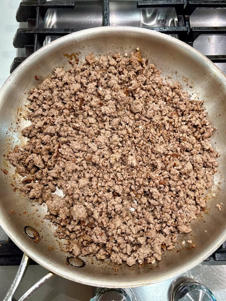 Browning the ground beef.