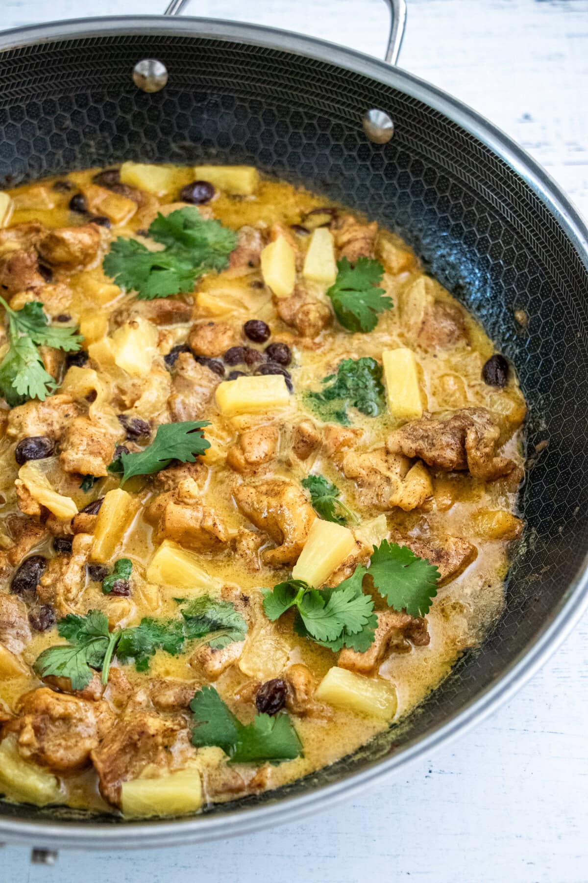Mild and fruity chicken curry with the perfect blend of sweet and spicy flavors! Quick and easy to make it's ready in 30 minutes! 30-Minute Pineapple Cinnamon Chicken Curry | Easy Weeknight Dinner