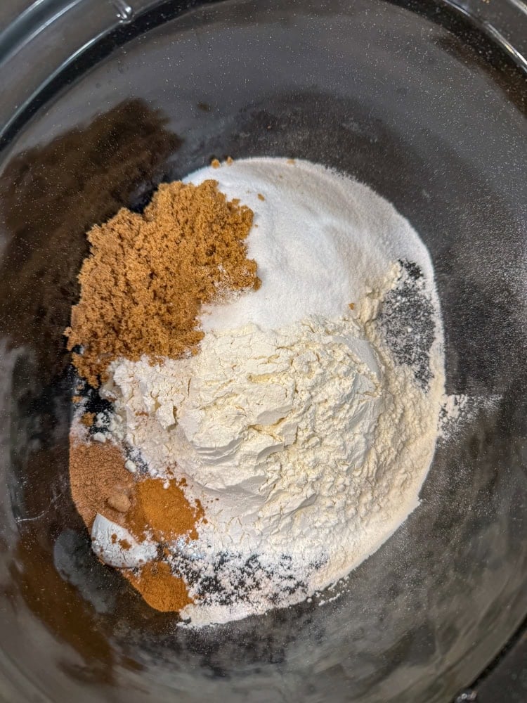 Whisk together the flour, sugar (3/4 cup), baking powder, salt, cinnamon, and nutmeg.