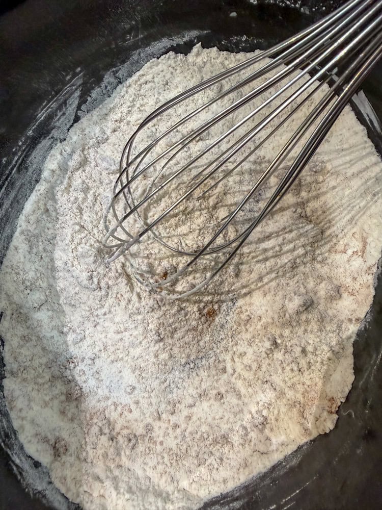 Whisk together the flour, sugar (3/4 cup), baking powder, salt, cinnamon, and nutmeg.