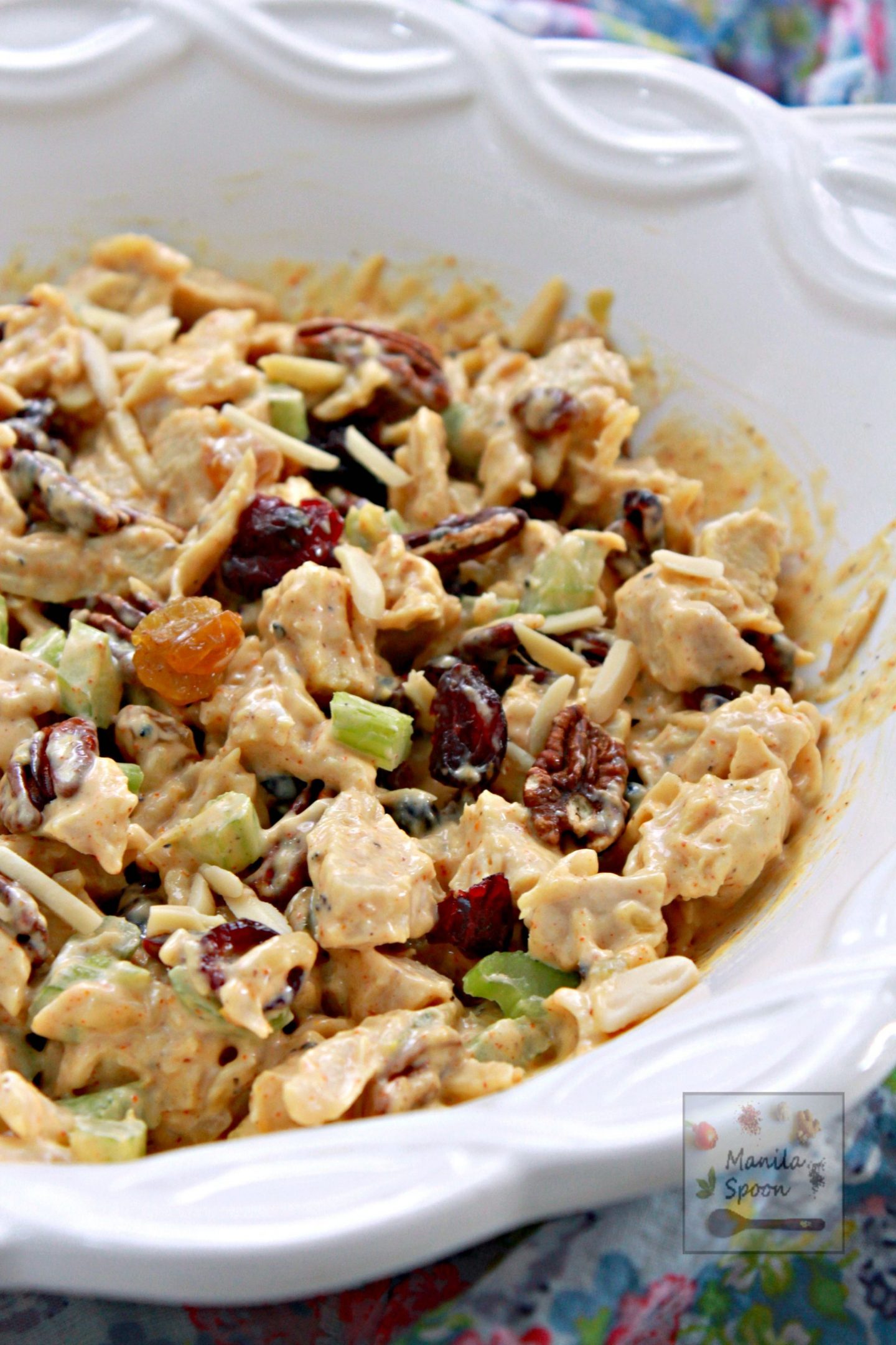This chicken salad comes together so quickly. Seasoned with curry powder and chutney and mixed in with fruits and nuts,  too it is so deliciously good! 