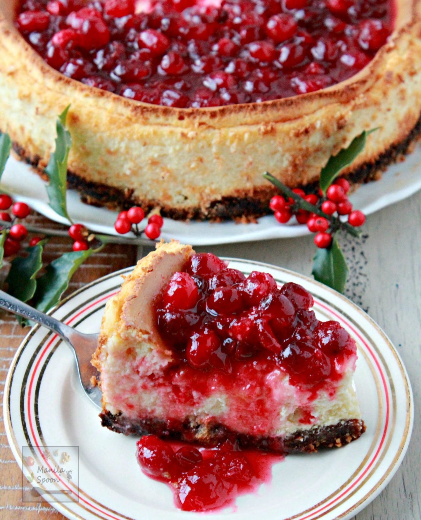 A deliciously creamy holiday cheesecake topped with a luscious sweet-tangy and perfectly spiced cranberry sauce. It is completely gluten-free so it's perfect for those on a wheat-free diet!