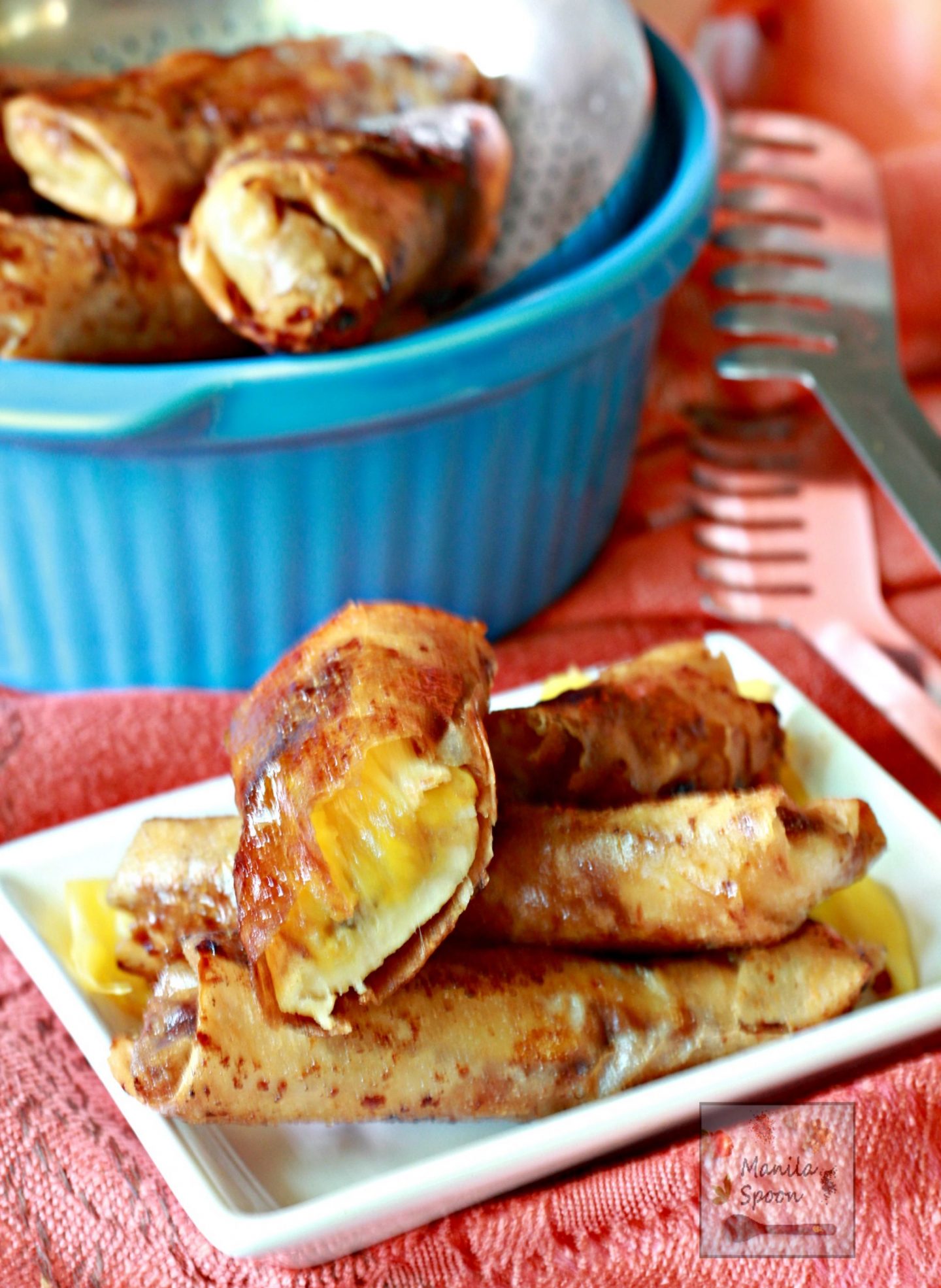 These Banana Spring Rolls or Lumpia - Turon - are the best way to use up all that ripe Bananas. Bananas are rolled in sugar and then wrap in spring roll wrappers with slices of jackfruit then cooked until perfectly crispy. This delicious caramelized Asian classic snack or dessert is a must-make. #turon #bananalumpia #bananaspringrolls #lumpia