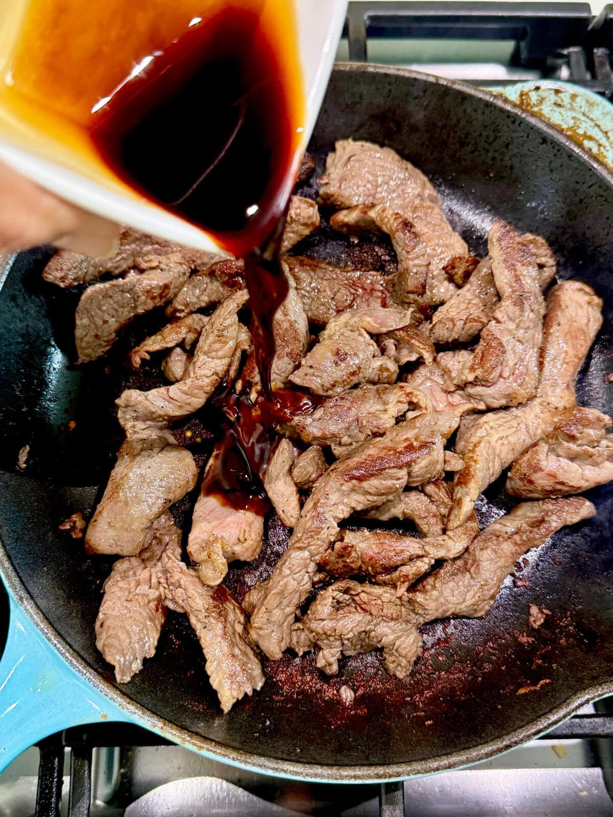 pouring seasoning sauce