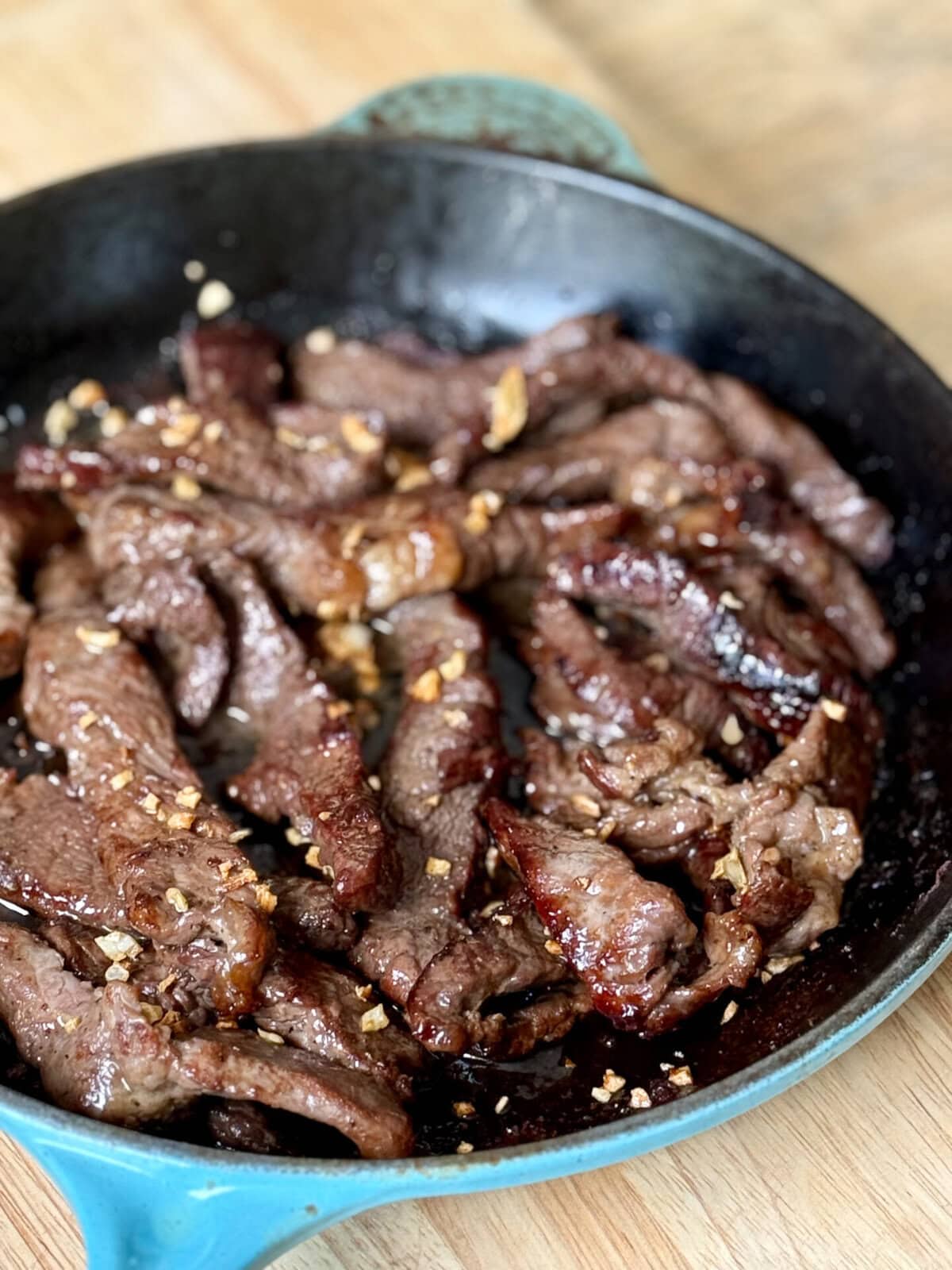 Beef Salpicao (Filipino Garlic and Butter Steak Bites) in a skillet