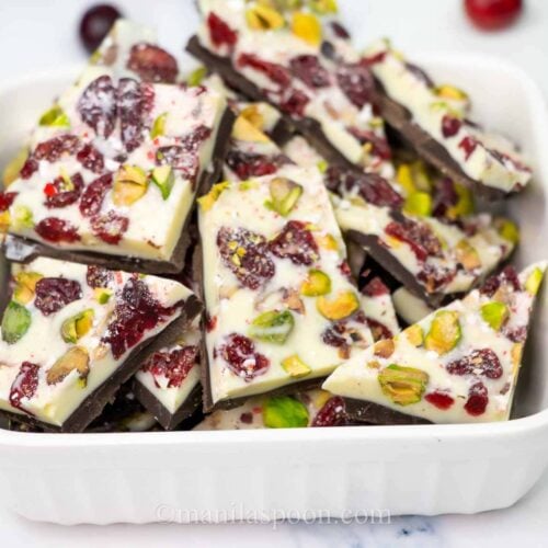 Make the holidays special with this Easy Double Chocolate Bark with Cranberries and Pistachios! Featuring layers of rich dark and creamy white chocolate topped with festive red cranberries and green pistachios, this quick and stunning candy is as delicious as it is beautiful!
