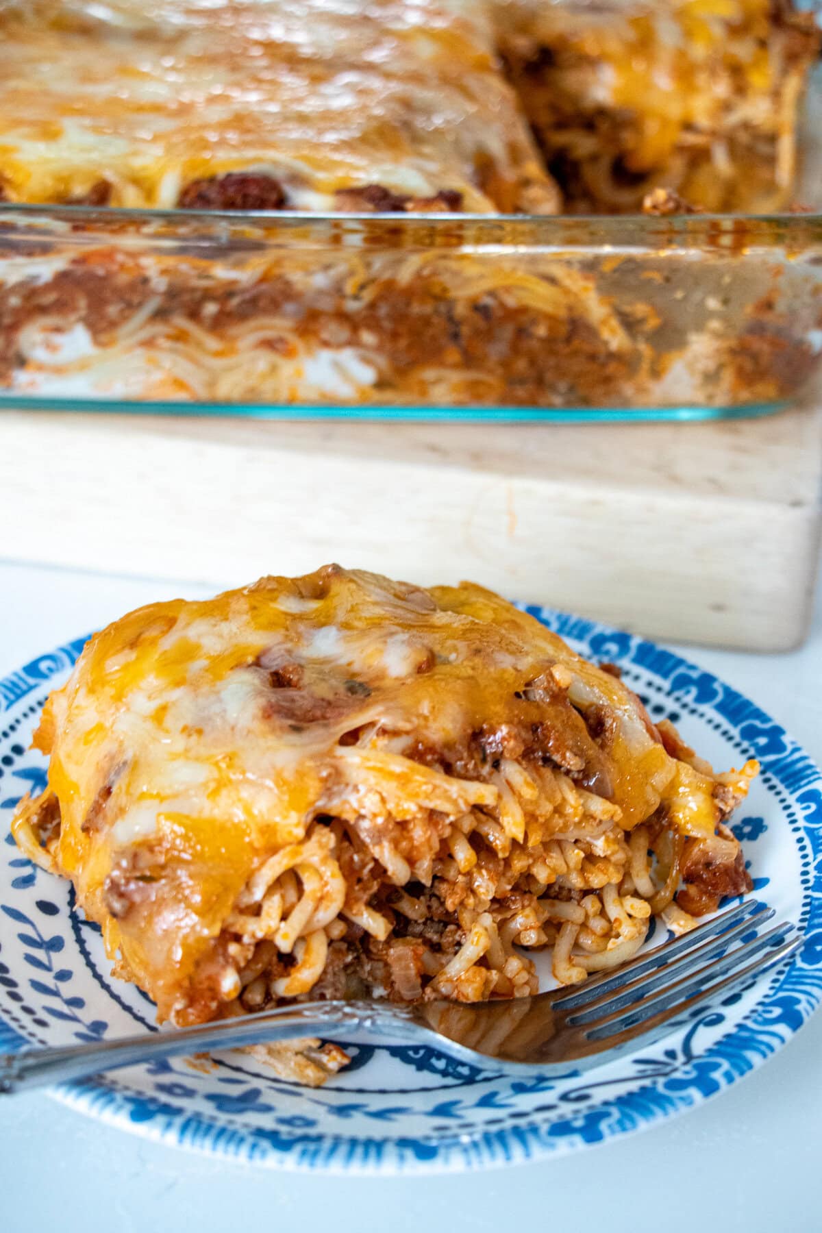 This baked spaghetti dish is so tasty and always a huge hit! With a combo of ground beef and Italian sausage plus herbs all simmered in a perfectly seasoned tomato sauce plus cream cheese mixture in between layers of pasta, your tastebuds are in for a treat. When company’s coming and I want easy but delicious comfort food, I always rely on this easy and creamy Million Dollar Spaghetti. Million Dollar Baked Spaghetti | Easy Make-Ahead Comfort Food
