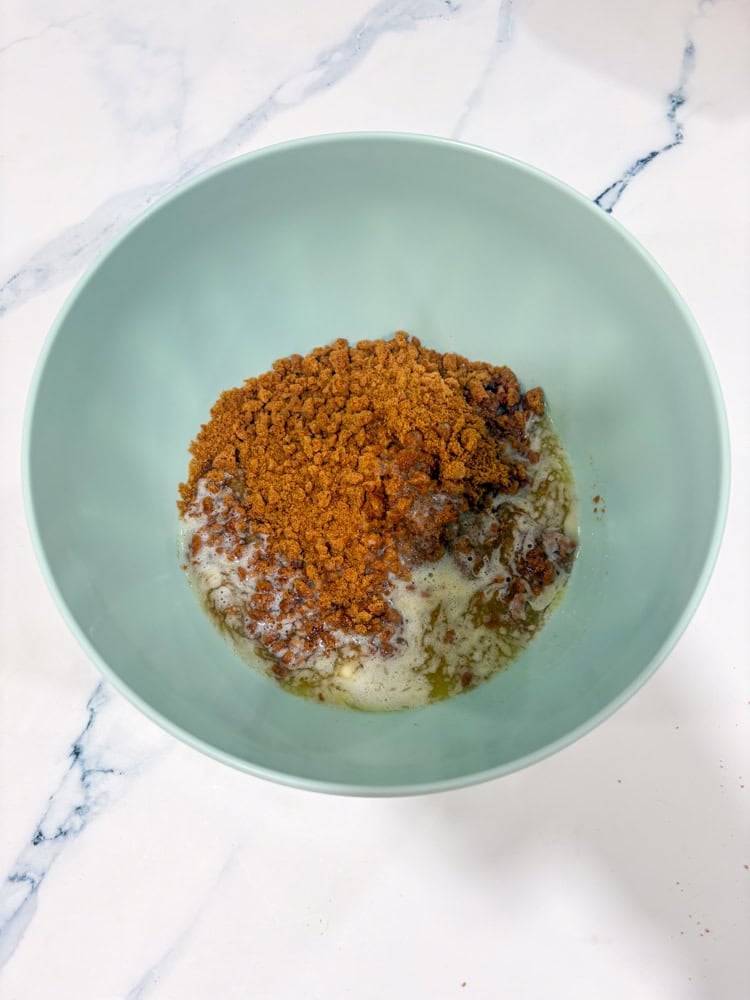 Stir crumbs, melted butter, and a pinch of salt until evenly moistened.