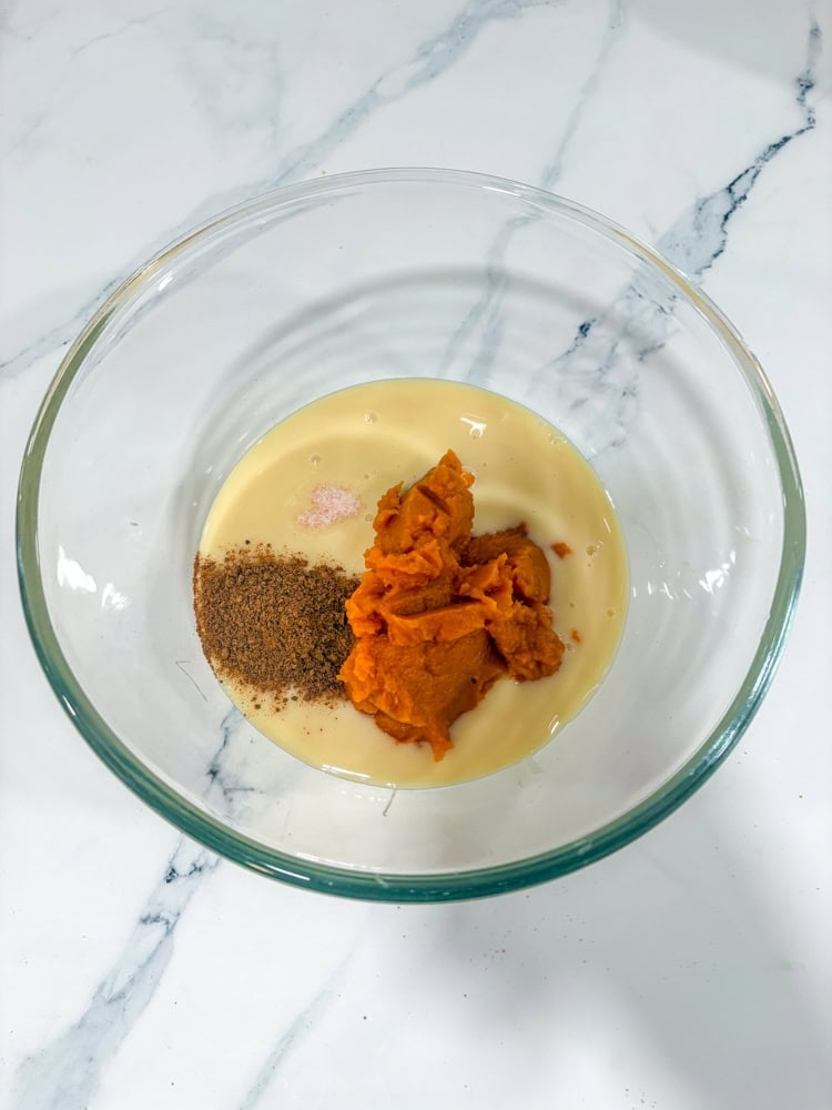 Whisk condensed milk, pumpkin, pumpkin pie spice, and a pinch of salt until smooth.