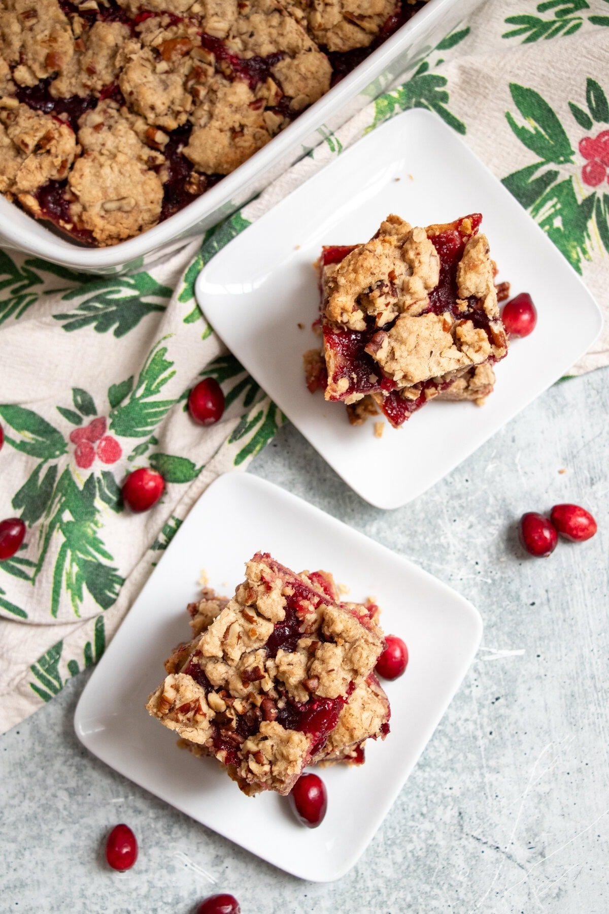 With a perfect balance of sweet and tart these scrumptious cranberry oat bars are the perfect holiday treat! The addition of chopped walnuts give them a nutty crunch that brings these yummy bars over the top. These bars can be made completely gluten-free and tastes as deliciously good!