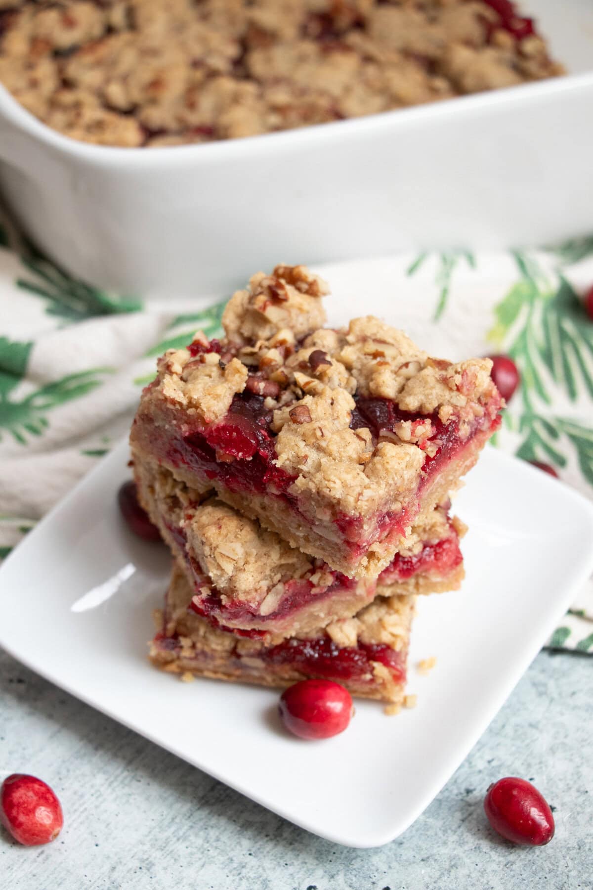 With a perfect balance of sweet and tart these scrumptious cranberry oat bars are the perfect holiday treat! The addition of chopped walnuts give them a nutty crunch that brings these yummy bars over the top. These bars can be made completely gluten-free and tastes as deliciously good!