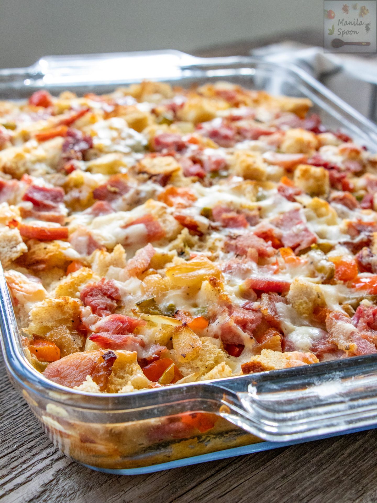 Loaded with ham, red and green peppers, bread, onion, and cheese, this super tasty and colorful ham strata is pleasing both to the eye and palate! It’s make-ahead, too so simply pop it in the oven for a delicious hot breakfast!