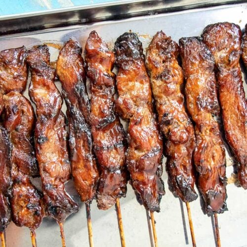 These succulent Filipino Pork Barbecue grilled pork skewers are marinated in a delightful blend of sweet and savory ingredients. The addition of lemon-lime adds a unique twist to the recipe that makes it both tender and delicious! Such a popular summer recipe in the Philippines and beyond.