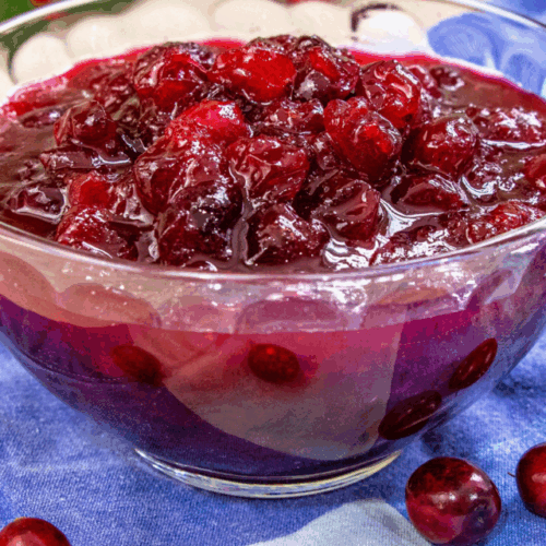 Flavored with orange juice and yummy spices like nutmeg, cardamom, cloves, and cinnamon this Spiced Cranberry Sauce will blow your taste buds away. It's seriously delicious and the perfect condiment for Thanksgiving, Christmas, and any holiday!