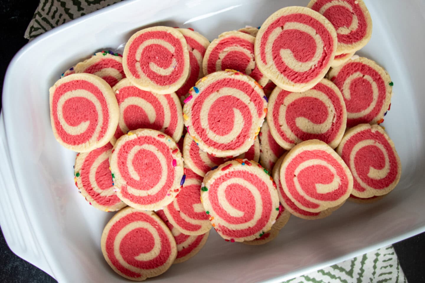 With a delightful blend of buttery deliciousness and vibrant colors, and enhanced by the addition of either almond or peppermint flavors to make it even more delectable, our Holiday Pinwheel Cookies truly stand out! Elevate your holiday baking with this visually stunning treat that's not only easy to make but also perfect for sharing the magic of the season. Step-by-step photo instructions are included with the recipe.