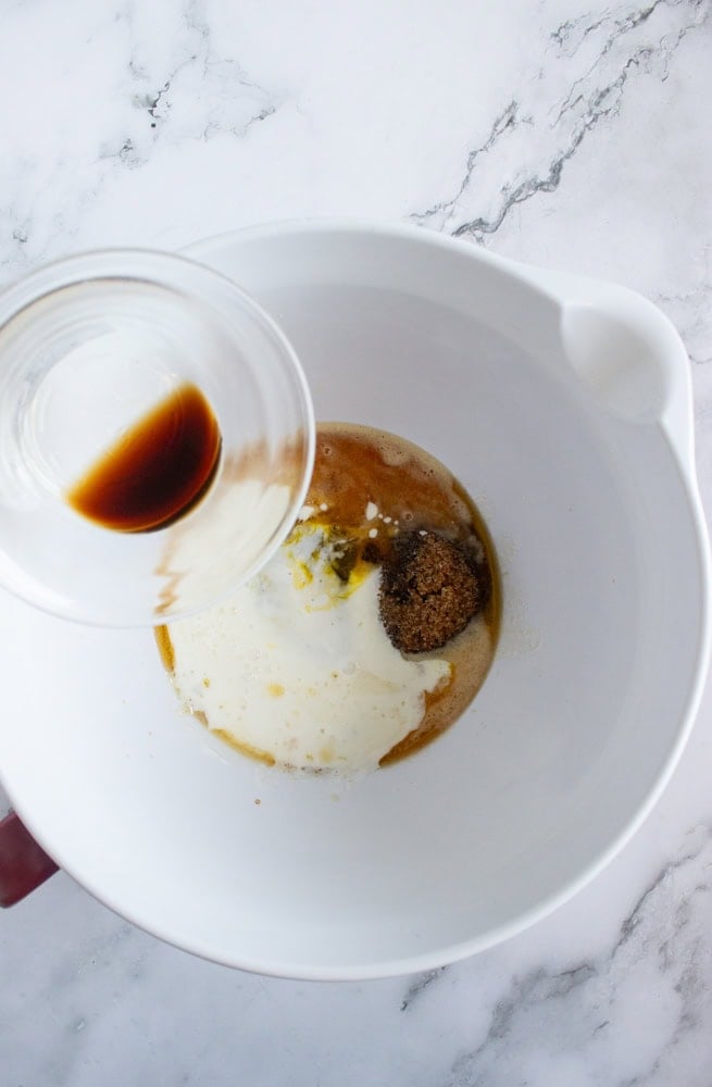 mixing wet ingredients for spiced apple cider baked donuts