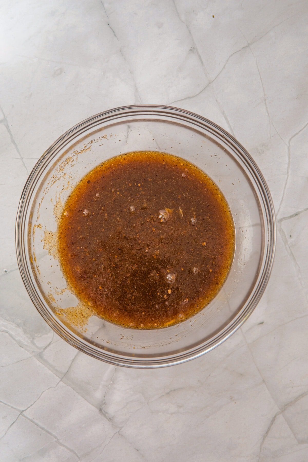 Beat in the egg, extra yolk, and vanilla extract until smooth and fully combined.