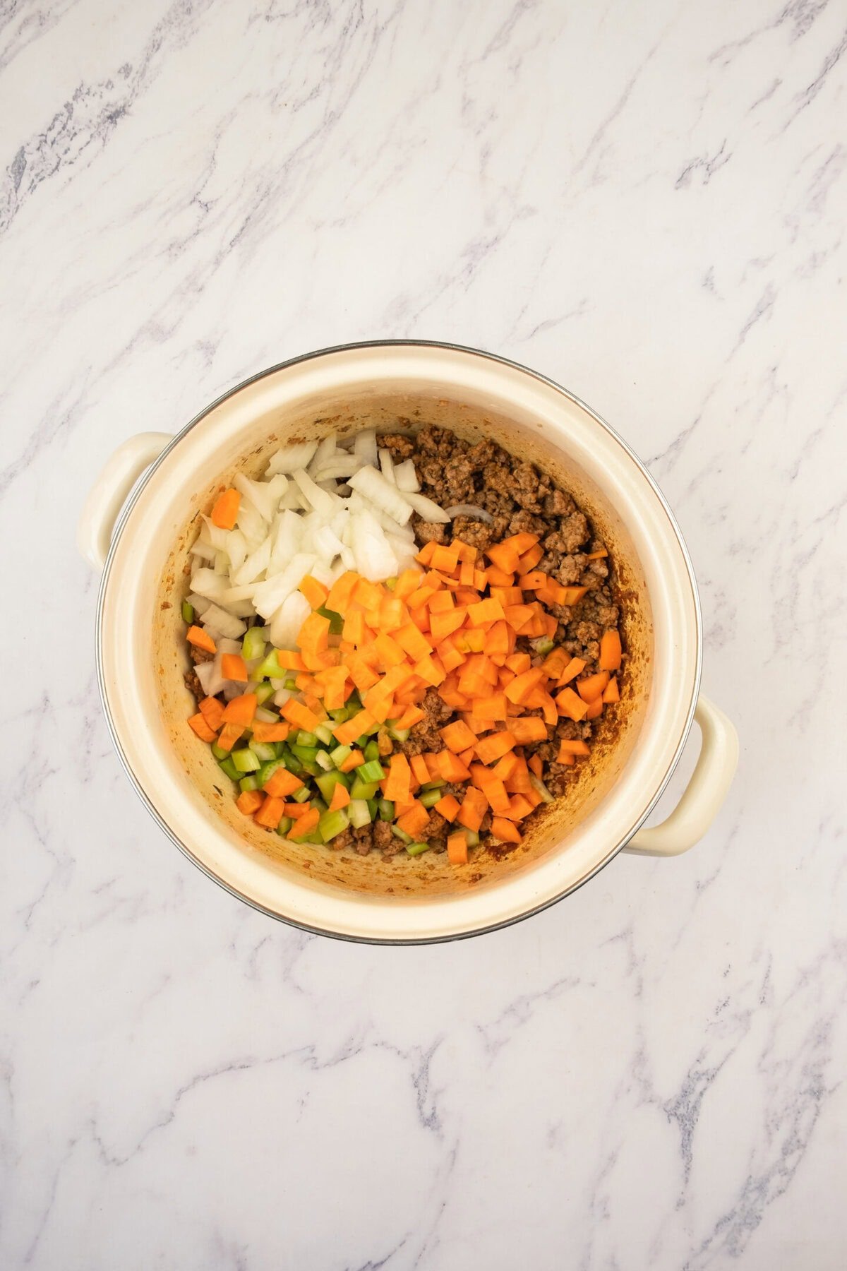 Stir in onions, carrots, and celery. Cook for about 5–6 minutes, until softened and fragrant. This step lays the flavor foundation for the soup.