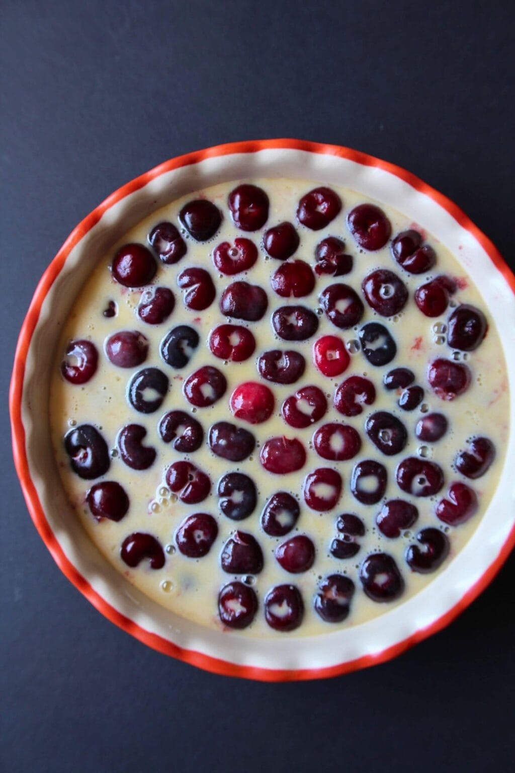 Egg mixture poured over the cherries.