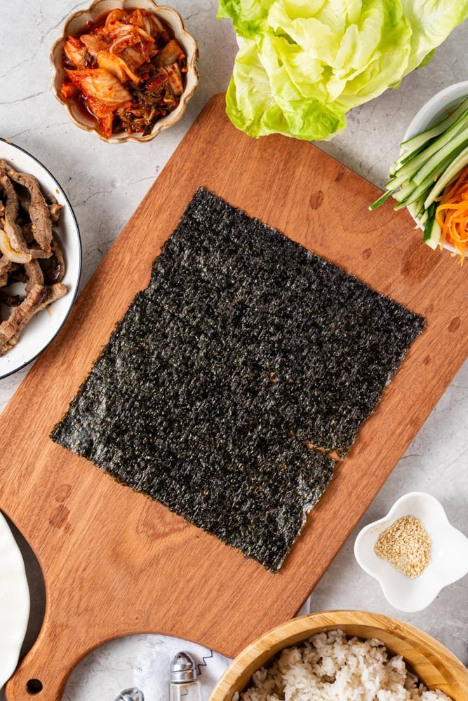 Place a seaweed sheet on a clean workspace.