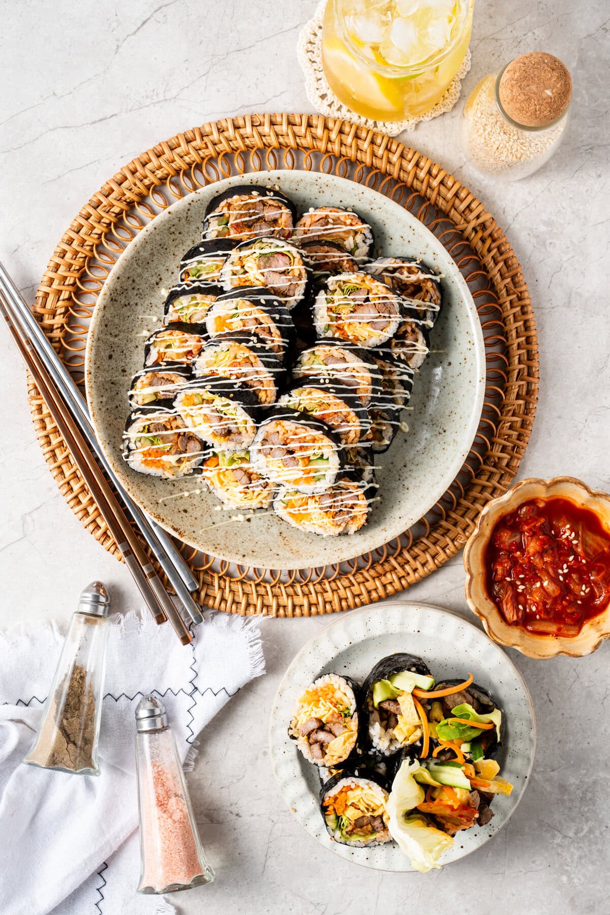 Bulgogi Kimbap with savory marinated beef, sesame rice, kimchi, egg, and crisp vegetables.